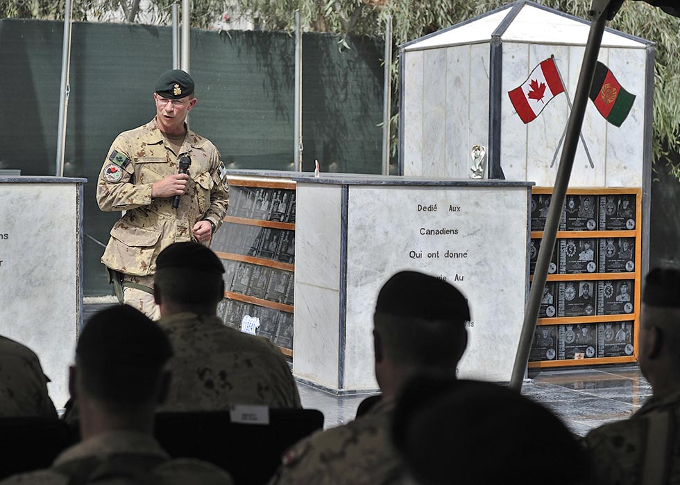 Brigadier-General Charles Lamarre makes his official comments as the Commander of the Mission Transition Task Force on July 17, 2011, with the Memorial of the Fallen in the background. Photo: Corporal Patrick Drouin, Mission Transition Task Force Headquarters. ©2011 DND/MDN Canada.